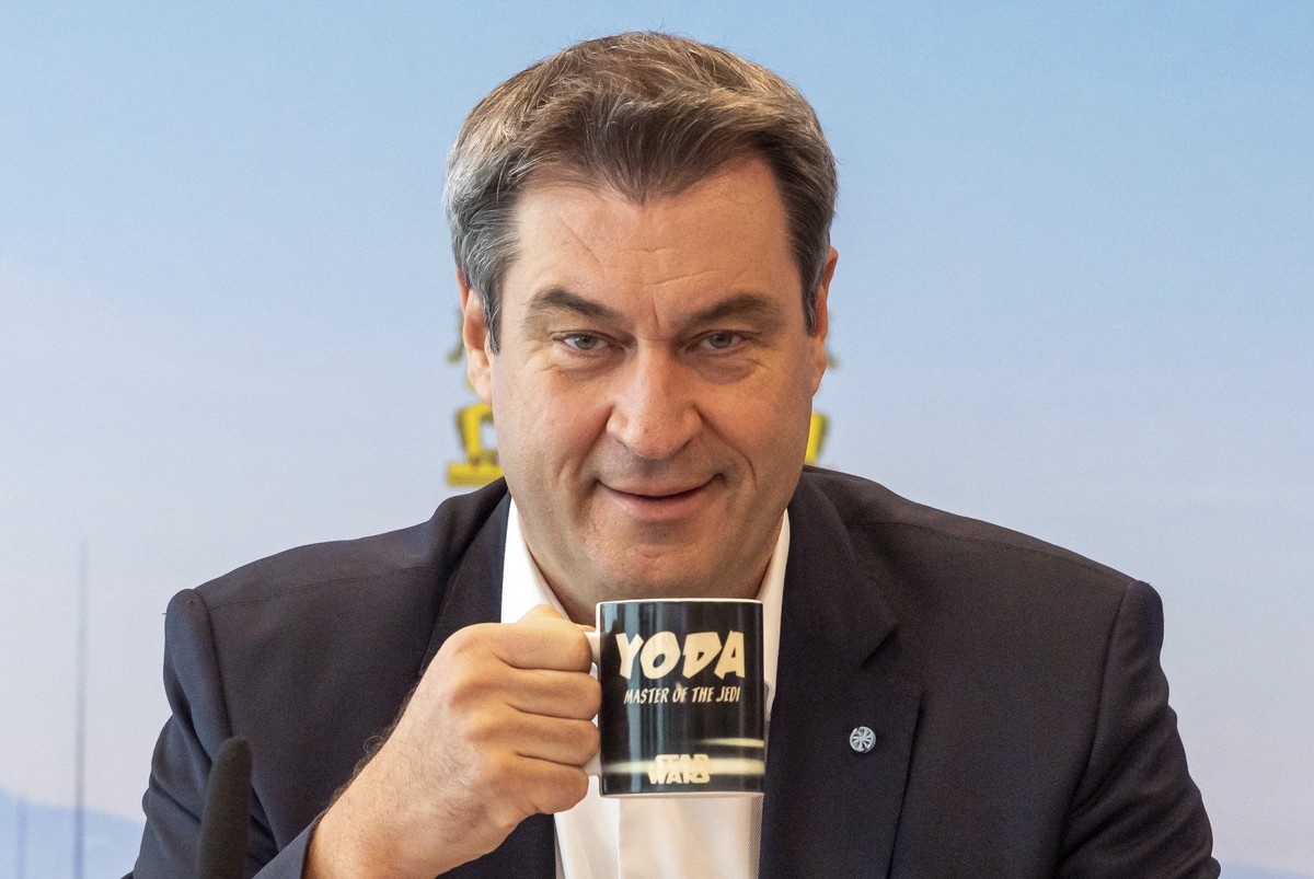 Markus Söder (CSU), Prime Minister of Bavaria, drinks from a Star Wars mug with the inscription "Yoda - Master of the Jedi" before the start of the meeting of the Bavarian cabinet, which is  ...