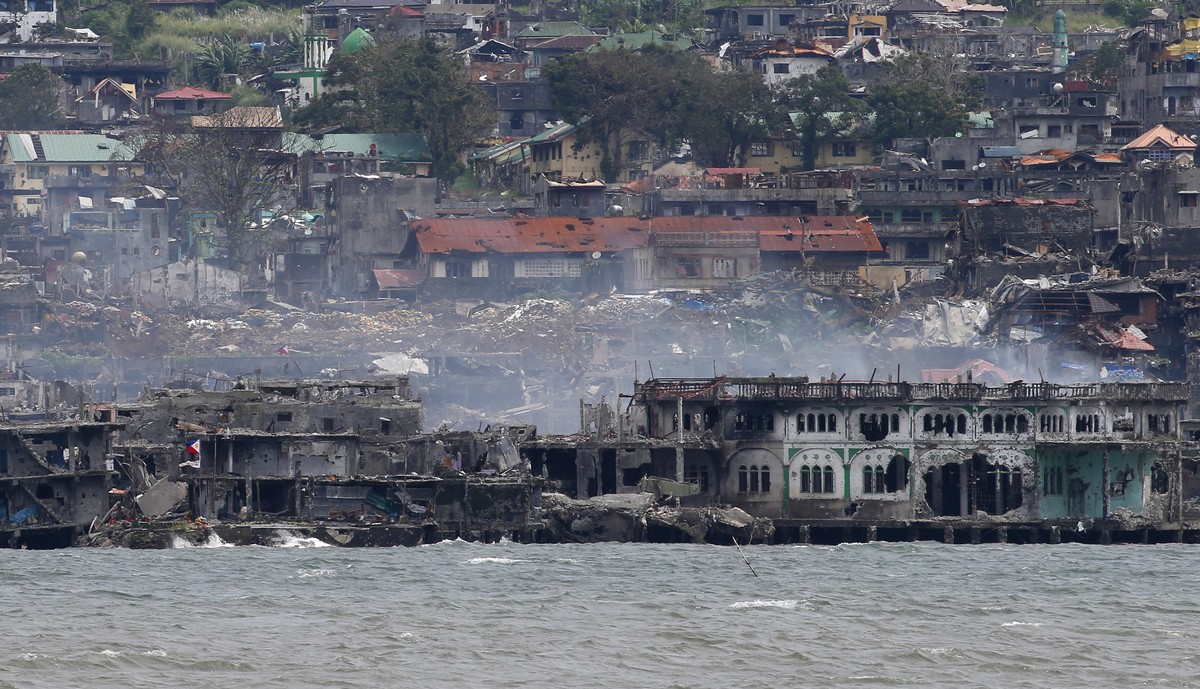Smoke rises from the "Main Battle Area" where pro-Islamic group militants are making a final stand amid a massive military offensive with government troops in Marawi city in southern Philipp ...