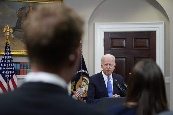 FILE - In this May 13, 2021, file photo President Joe Biden responds to questions from the media after delivering remarks about the Colonial Pipeline hack, in the Roosevelt Room of the White House in  ...