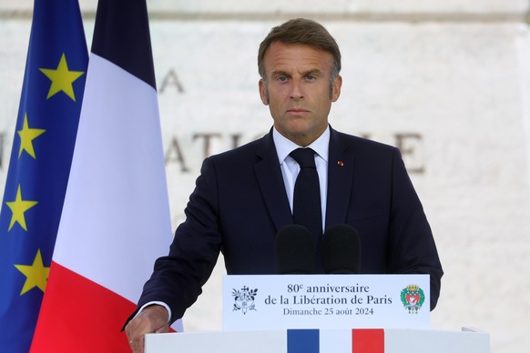 epa11564430 French President Emmanuel Macron delivers a speech during a ceremony commemorating the 80th anniversary of the Liberation of Paris next to the Denfert Rochereau Square in Paris, France, 25 ...