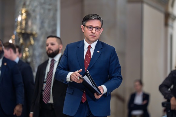 Speaker of the House Mike Johnson, R-La., walks from the chamber to speak with reporters after the final vote to bring the longest government shutdown in history to an end, at the Capitol in Washingto ...