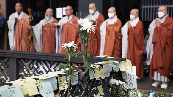 epa10277970 Buddhist monks pay tribute to victims of the Seoul Halloween stampede, in Seoul, South Korea, 01 November 2022. According to the National Fire Agency, at least 154 people were killed and 1 ...