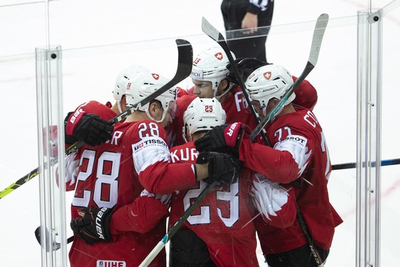 Switzerland&#039;s forward Timo Meier #28 celebrates with teammates after scoring the 1:4, during the IIHF 2021 World Championship preliminary round game between Czech Republic and Switzerland, at the ...