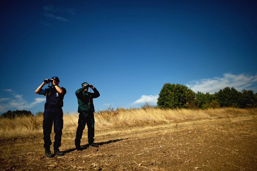 epa07468432 (FILE) - European Border and Coast Guard Agency officers from Netherlands (L) and Bulgaria (R) monitor the border between Bulgaria and Turkey at the check point Kapitan Andreevo, southeast ...