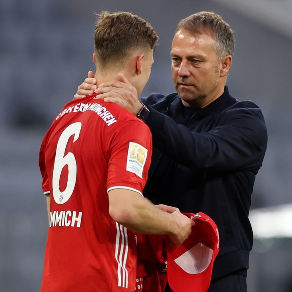 epa09186213 Hans-Dieter Flick, Head Coach of FC Bayern Muenchen celebrates victory with Joshua Kimmich after the Bundesliga match between FC Bayern Muenchen and Borussia Moenchengladbach at Allianz Ar ...