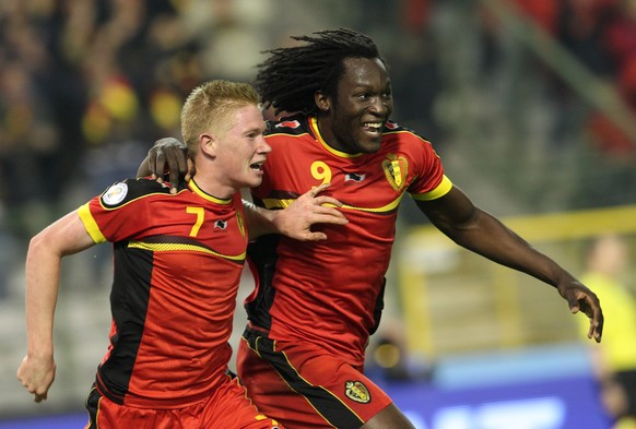 FILE - In this Oct. 15, 2013, file photo, Belgium's Kevin De Bruyne, left, and Romelu Lukaku celebrate after Kevin De Bruyne scored during their World Cup Group A qualifying soccer match against Wales, at the King Baudouin stadium in Brussels. (AP Photo/Yves Logghe)