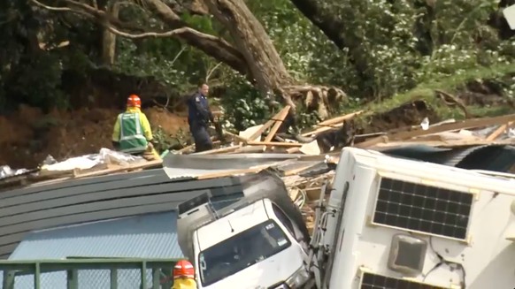 In this image from a video, a police officer with dog searches people near the site of a landlide at the base of Mount Maunganui on New Zealands North Island Thursday, Jan. 22, 2026. (TVNZ via AP)
Ne ...