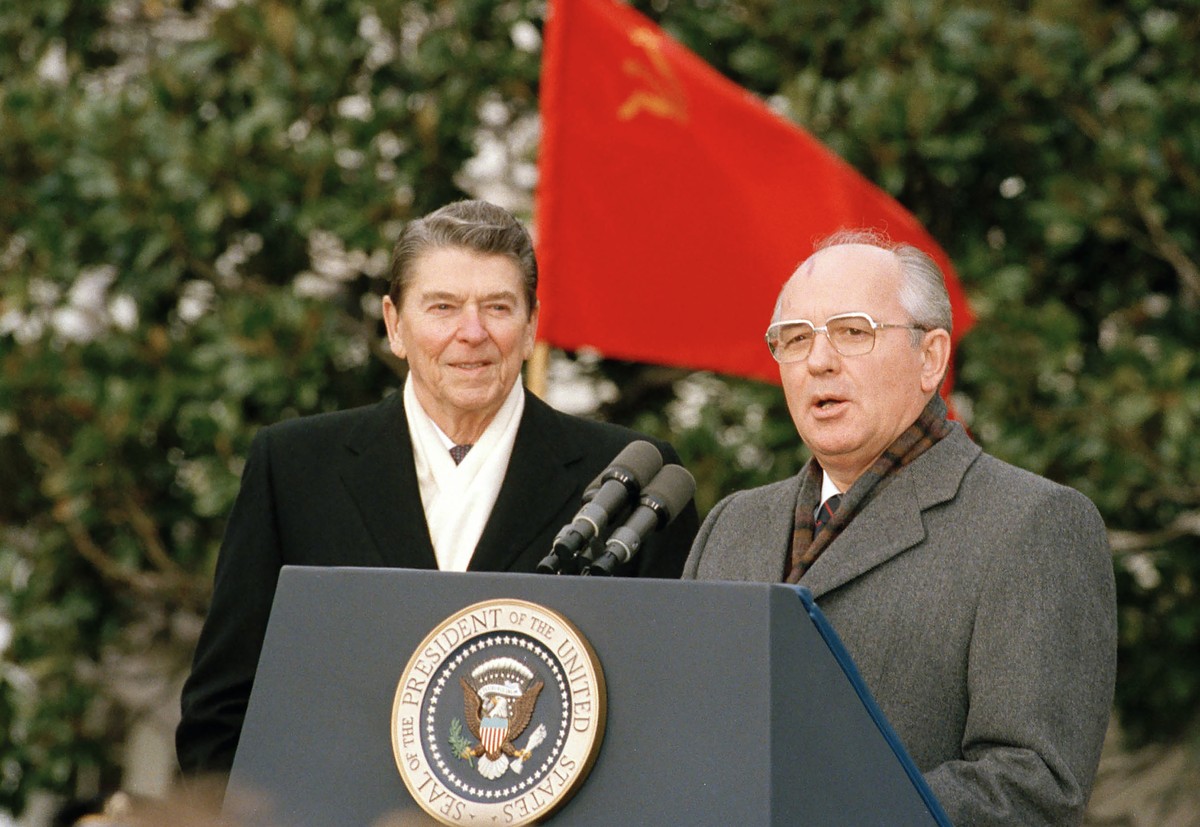 FILE -Soviet leader Mikhail Gorbachev, right, and U.S. President Ronald Reagan speak to press in Washington, USA, Tuesday, Dec. 8, 1987. Russian news agencies are reporting that former Soviet Presiden ...