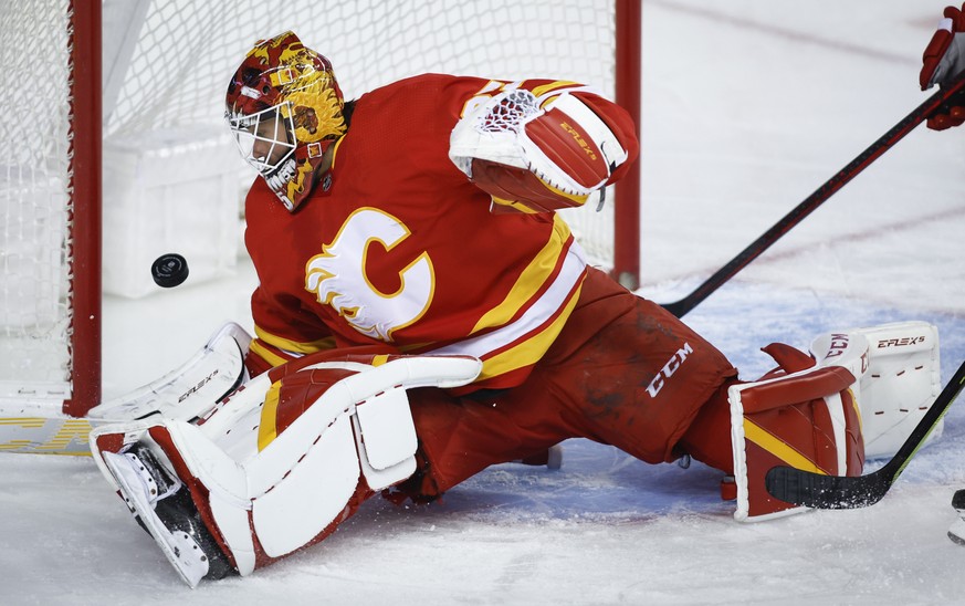Calgary Flames goalie Jacob Markstrom tracks the puck during the second period of an NHL hockey game against the Toronto Maple Leafs on Thursday, Feb. 10, 2022, in Calgary, Alberta. (Jeff McIntosh/The ...
