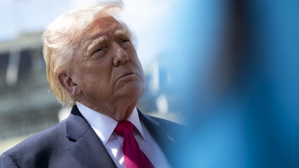 epa12894726 US President Donald Trump speaks to members of the media on the South Lawn of the White House before departing on Marine One, in Washington, DC, USA, 16 April 2026. President Trump is trav ...