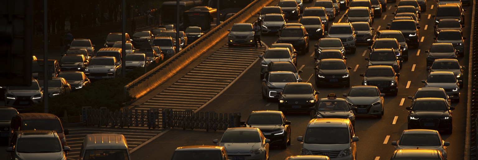 FILE - In this Sept. 6, 2019, file photo, commuters make their way along an expressway during rush hour in Beijing. China&#039;s auto sales sank 5.4% in November from a year ago, putting the industry& ...