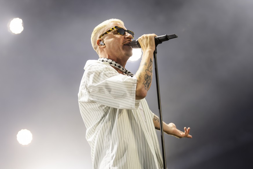 epa12254162 US singer Macklemore performs on stage during the 48th edition of the Paleo Festival in Nyon, Switzerland, 22 July 2025. The Paleo is an open-air music festival that takes place from 22 to ...