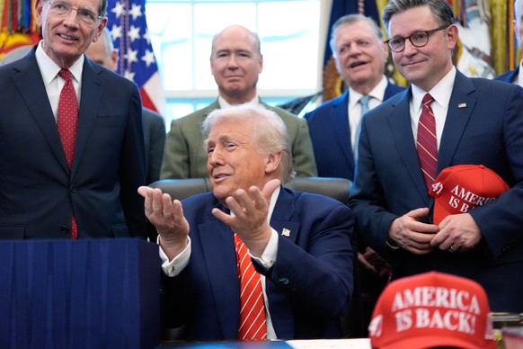 President Donald Trump speaks to reporters after signing a spending bill that ends a partial shutdown of the federal government in the Oval Office of the White House, Tuesday, Feb. 3, 2026, in Washing ...