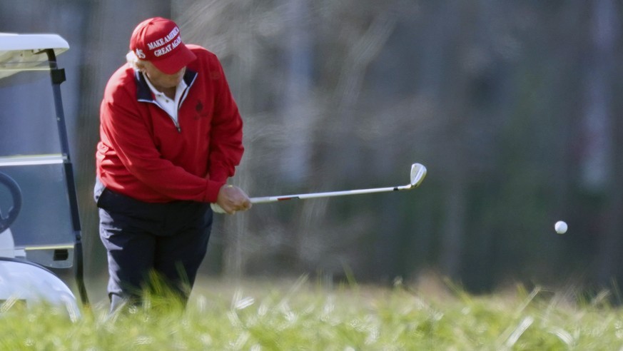 FILE - In this Nov. 28, 2020, file photo President Donald Trump plays golf at Trump National Golf Club in Sterling, Va. (AP Photo/Alex Brandon, File)
Donald Trump
