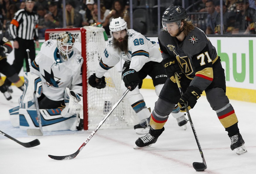 Vegas Golden Knights center William Karlsson (71) skates around San Jose Sharks defenseman Brent Burns (88) during the second period of Game 1 of an NHL hockey second-round playoff series, Thursday, A ...