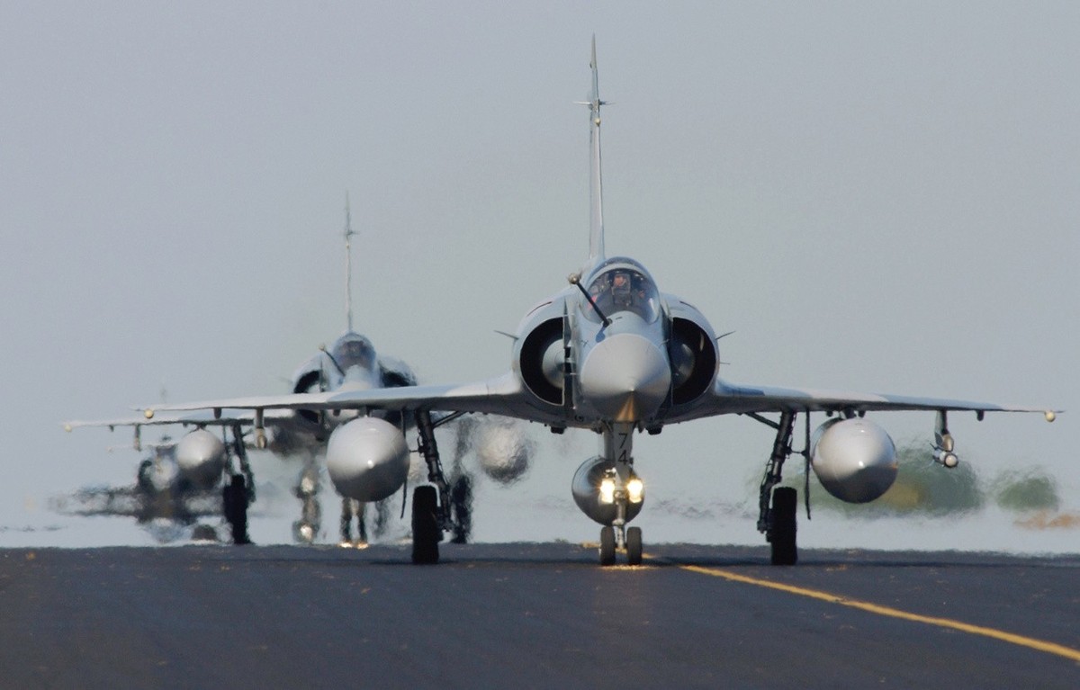 French Air Force Mirage 2000-5 F aircraft taxi in line after landing at RAAF Darwin, Australia, on Bastille Day, July 14, 2004 in preparation for Exercise Pitch Black. Exercise Pitch Black which runs  ...