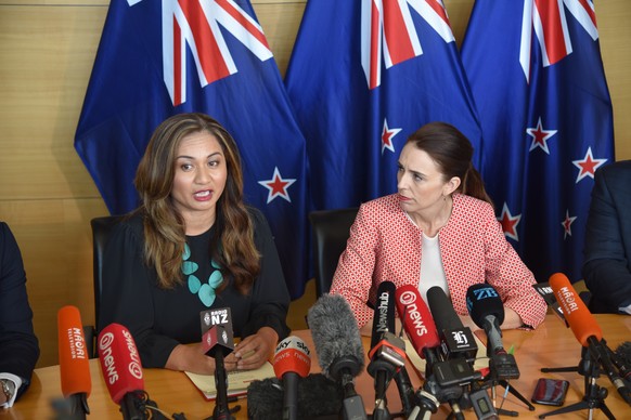 epa08790244 New Zealand Prime Minister Jacinda Ardern (R) and Greens co-leader Marama Davidson (L) speak during the signing of a government cooperation agreement between Labour and the Greens parties  ...