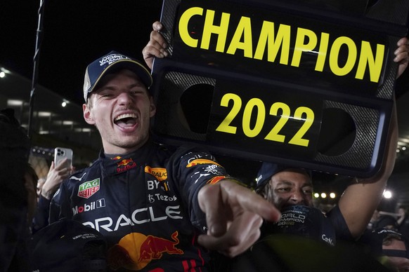 Red Bull driver Max Verstappen of the Netherlands celebrates with teammates as he became F1 drivers world champion, during the Japanese Formula One Grand Prix at the Suzuka Circuit in Suzuka, central  ...