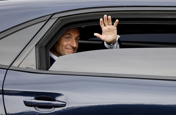 French President Emmanuel Macron leaves after attending Bastille Day military parade on the Avenue Foch in Paris Sunday, July 14, 2024. (Ludovic Marin, Pool via AP)