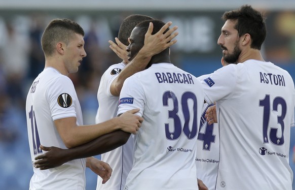 Fiorentina&#039;s Khouma Babacar, center, celebrates after scoring his sideÂs second goal during the Europa League group I soccer match between Belenenses and Fiorentina at the Restelo stadium in Lis ...