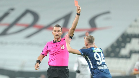 Referee Bahattin Simsek shor red card to Florent Hadergjonaj of Kasimpasa during the Turkish Super league football match between Besiktas and Kasimpasa at Vodafone Park in Istanbul , Turkey on Decembe ...