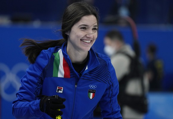 Italy&#039;s Stefania Constantini, smiles after winning the mixed doubles match against Norway, at the 2022 Winter Olympics, Friday, Feb. 4, 2022, in Beijing. (AP Photo/Nariman El-Mofty)