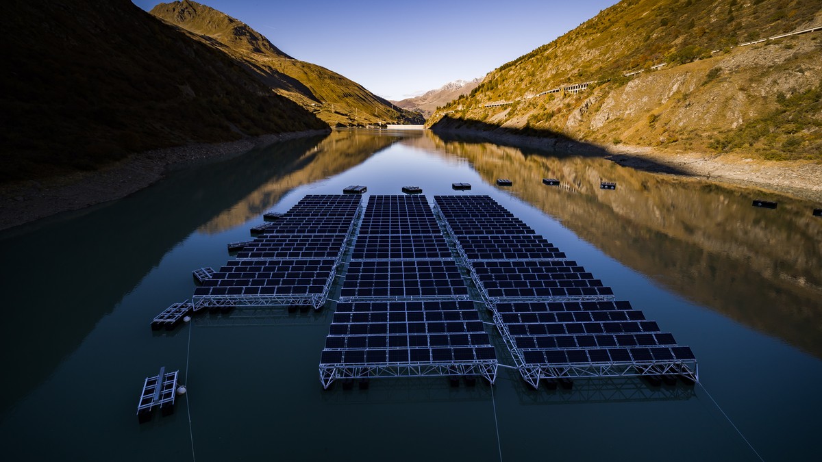 epa07906934 Floating barges with solar panels are pictured on the Lac des Toules, an alpine reservoir lake, in Bourg-Saint-Pierre, Switzerland, 08 October 2019 (issued 09 October 2019) Upon completion ...