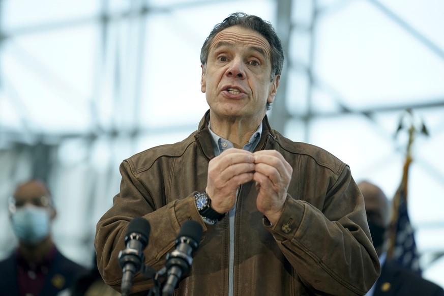 epa09062643 New York Gov. Andrew Cuomo speaks at press conference during a visit to a vaccination site in the Jacob K. Javits Convention Center in New York, New York, USA, on 08 March 2021. EPA/SETH W ...