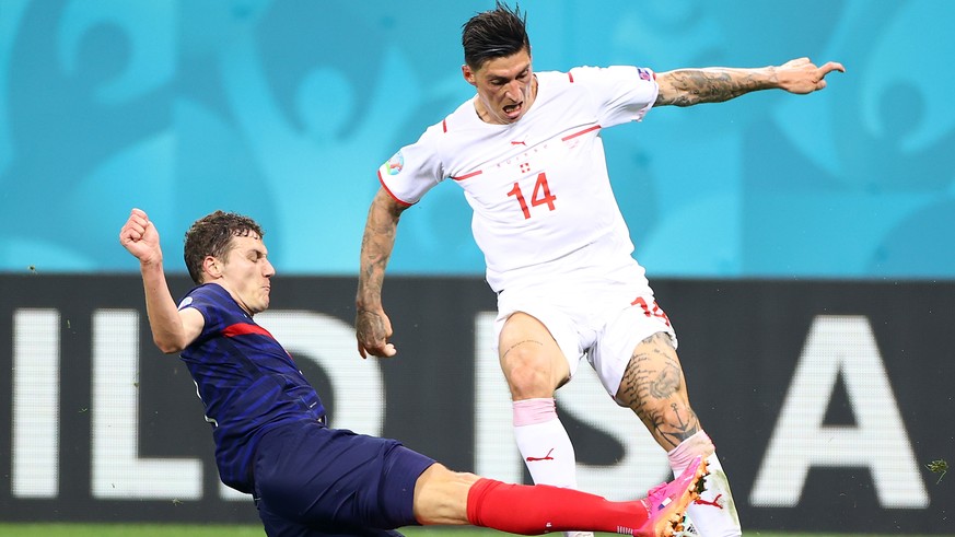 epa09309398 Benjamin Pavard of France fouls Steven Zuber of Switzerland (top) during the UEFA EURO 2020 round of 16 soccer match between France and Switzerland in Bucharest, Romania, 28 June 2021. EPA ...