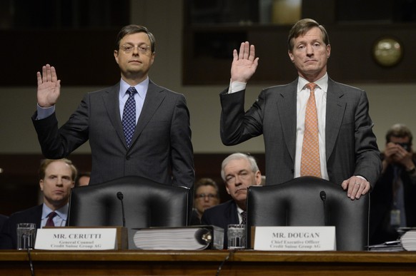 epa04101270 General counsel of Credit Suisse Group AG Romeo Cerutti (L) and CEO of Credit Suisse Group AG Brady Dougan (R) are sworn-in to testify before the Senate Homeland Security and Governmental  ...