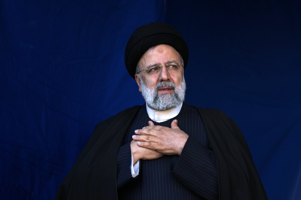 FILE - Iranian President Ebrahim Raisi places his hands on his heart as a gesture of respect to the crowd in a ceremony in the southeastern city of Kerman, Iran, on Jan. 5, 2024. (AP Photo/Vahid Salem ...