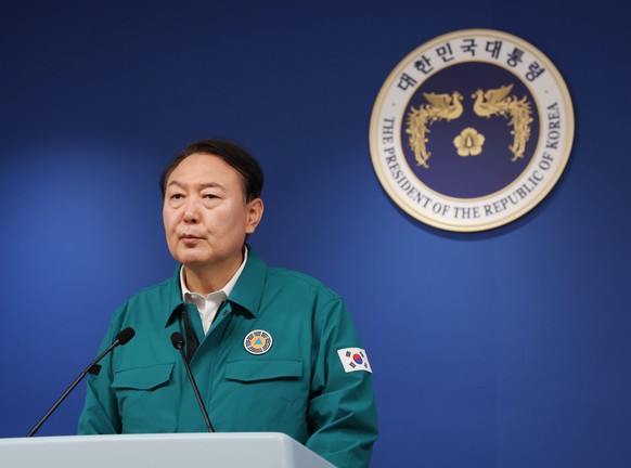 epa10274547 President Yoon Suk-yeol addresses the nation on the stampede that occurred during Halloween celebrations in the Itaewon district, in Seoul, South Korea, 30 October 2022. According to the N ...