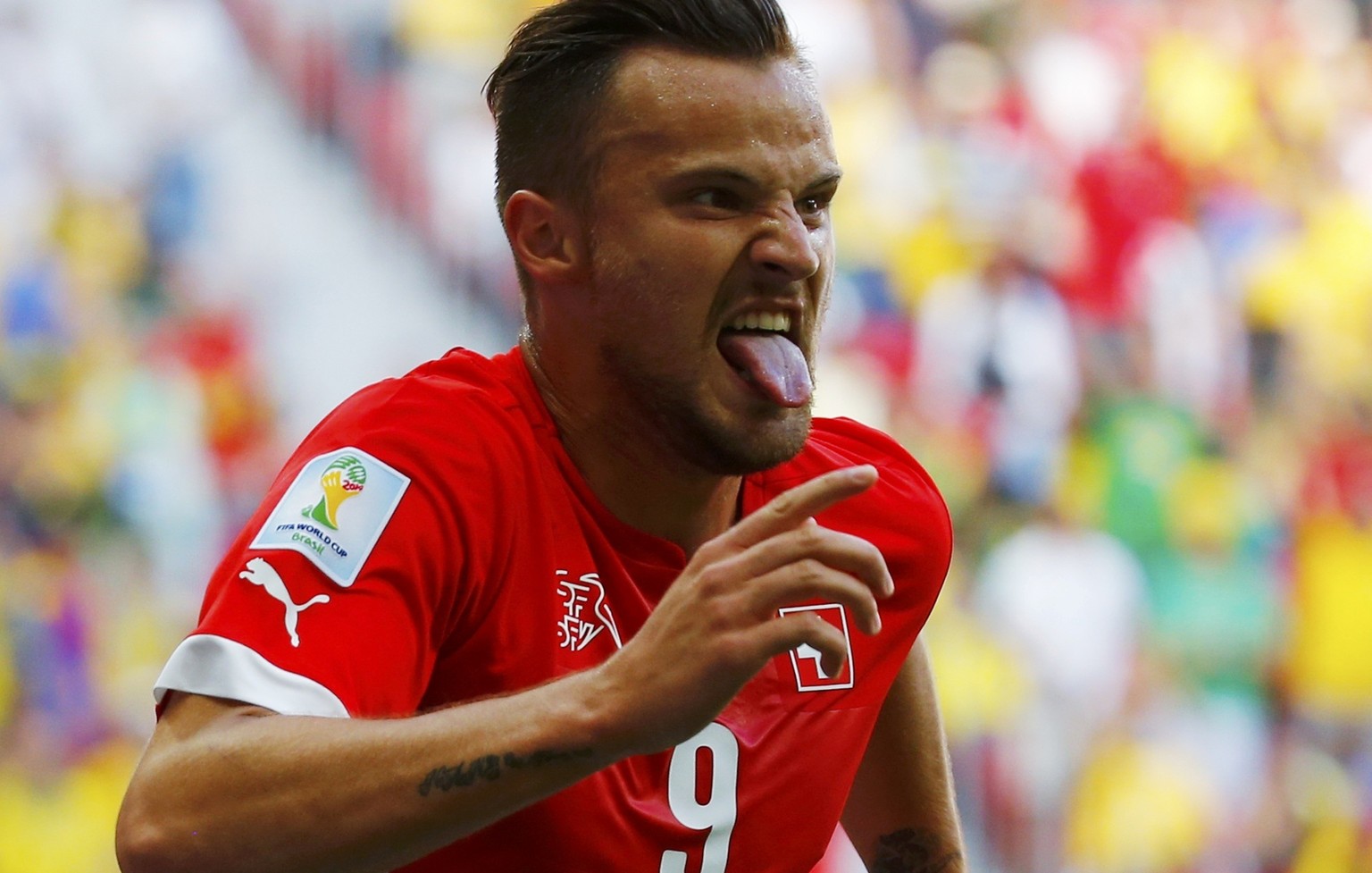 Switzerland&#039;s Haris Seferovic celebrates after scoring a goal to defeat Ecuador in their 2014 World Cup Group E soccer match at the Brasilia national stadium in Brasilia, June 15, 2014. REUTERS/P ...