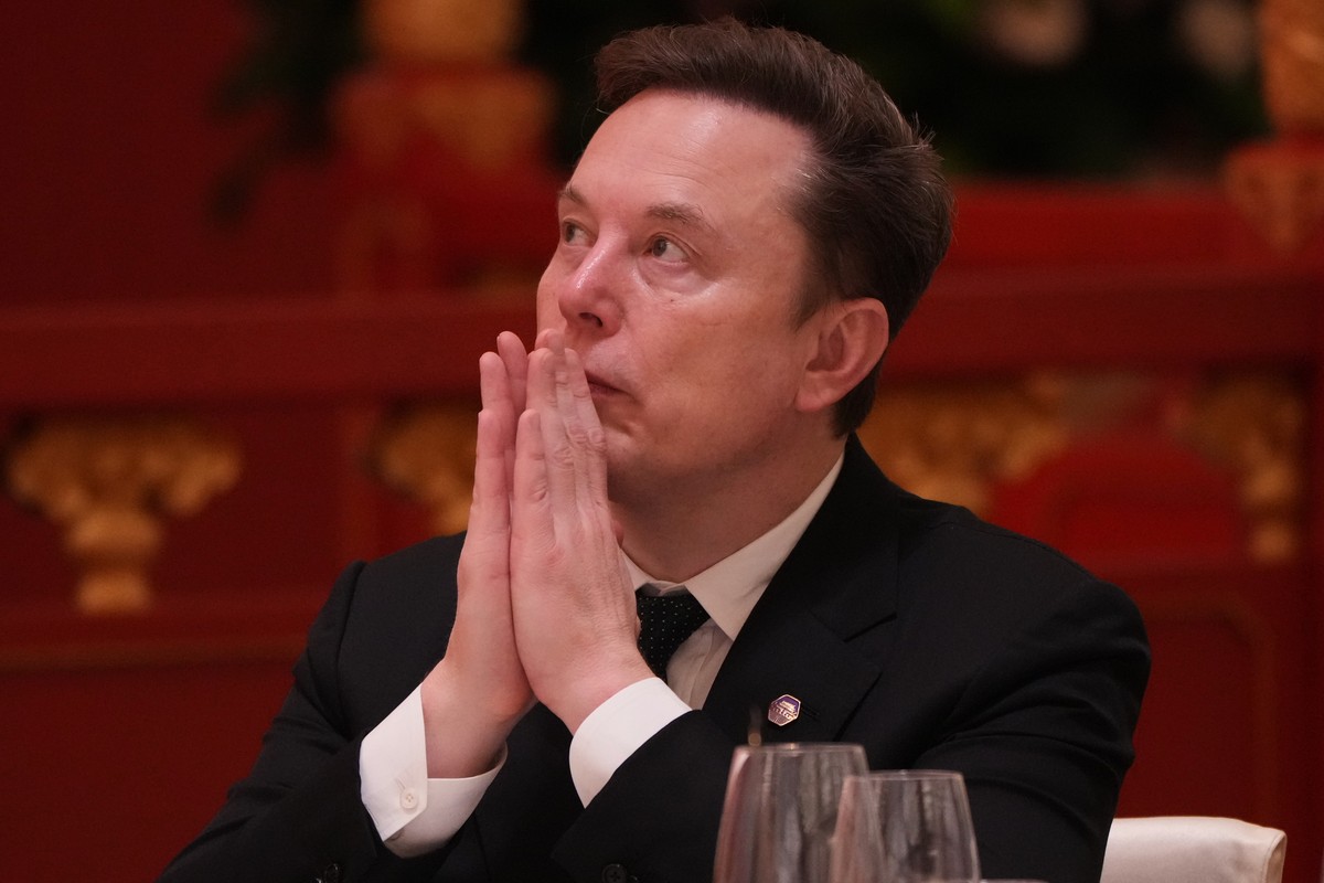 Elon Musk listens to the speech of Chinese President Xi Jinping during a state dinner with President Donald Trump at the Great Hall of the People on Thursday May 14, 2026, in Beijing. (AP Photo/Mark S ...