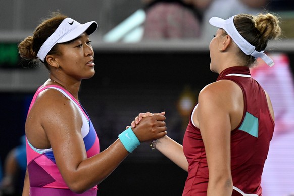 epa09699412 Naomi Osaka of Japan (L) shakes hands with Amanda Anisimova of the USA following her loss in their third round Women?s singles match on Day 5 of the Australian Open Tennis Tournament at Melbourne Park in Melbourne, Australia, 21 January 2022.  EPA/DEAN LEWINS  AUSTRALIA AND NEW ZEALAND OUT