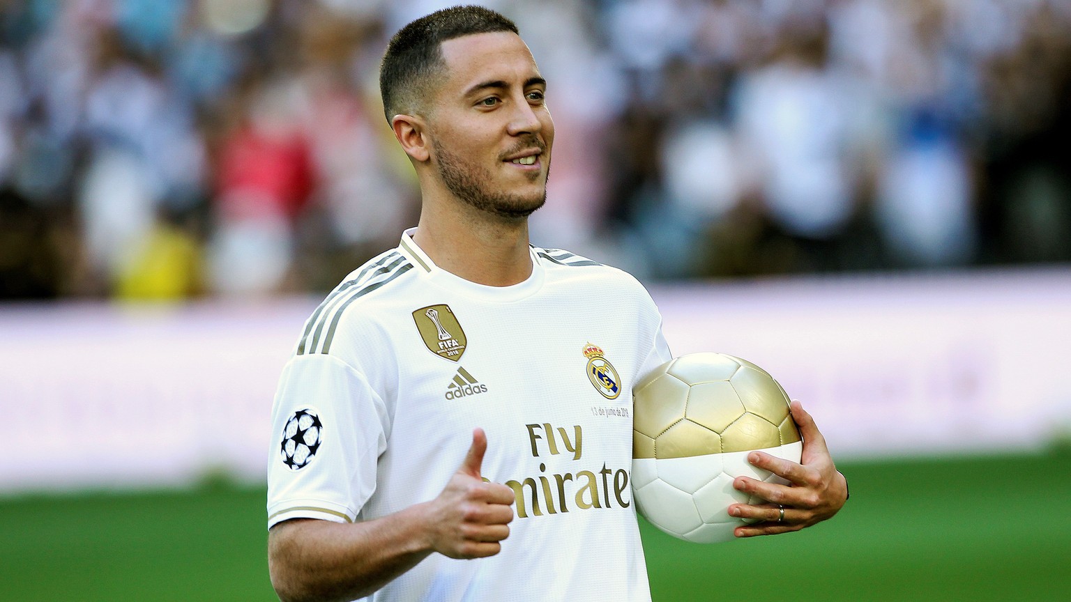 epa07646259 Real Madrid&#039;s new soccer player Eden Hazard poses for the photographers during his presentation at Santiago Bernabeu stadium in Madrid, Spain, 12 June 2019. Belgian Eden Hazard has si ...