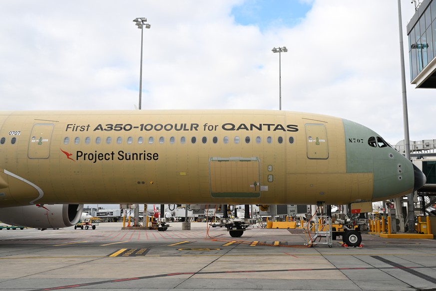 epa13129504 An Airbus A350-1000ULR, developed for Qantas' Project Sunrise, is unveiled during a media tour and an announcement by Australia's flag carrier airline Qantas, at Melbourne Intern ...