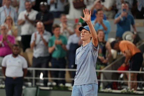 Jannik Sinner of Italy celebrates after winning the first round men's singles tennis match against Clement Tabur of France at the French Open tennis tournament in Paris, Tuesday, May 26, 2026. (A ...