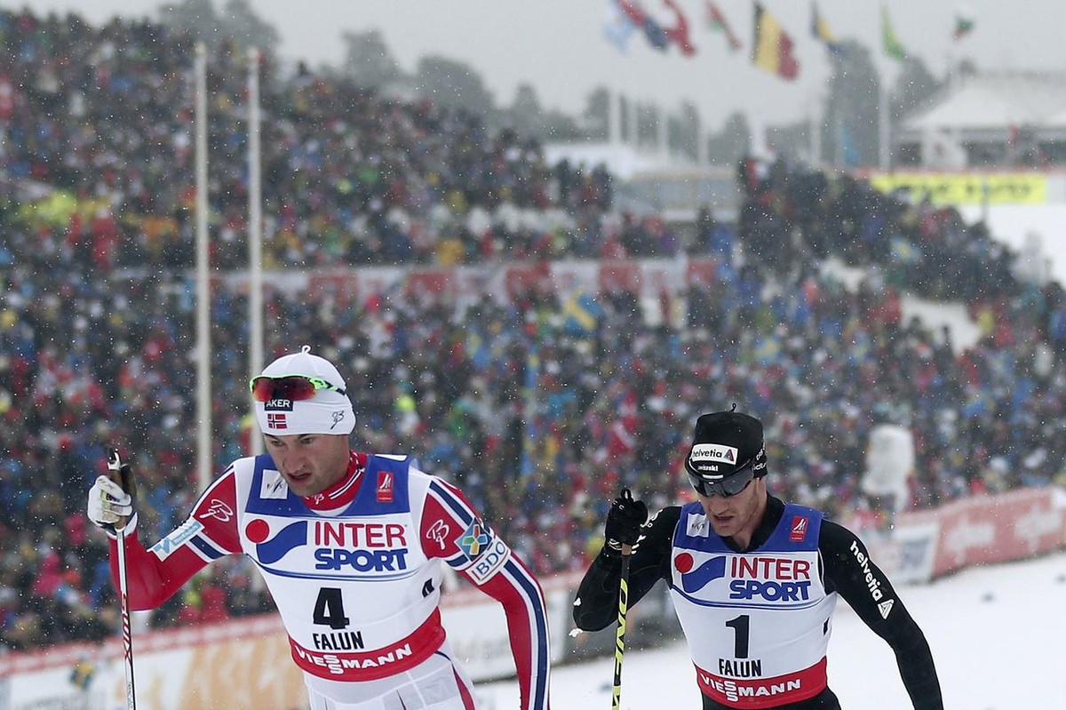 Switzerland's Dario Cologna in action behind Norway's Petter Northug during the men's 50 km classic mass start competition at the 2015 Nordic World Skiing Championships in Falun, Sweden ...