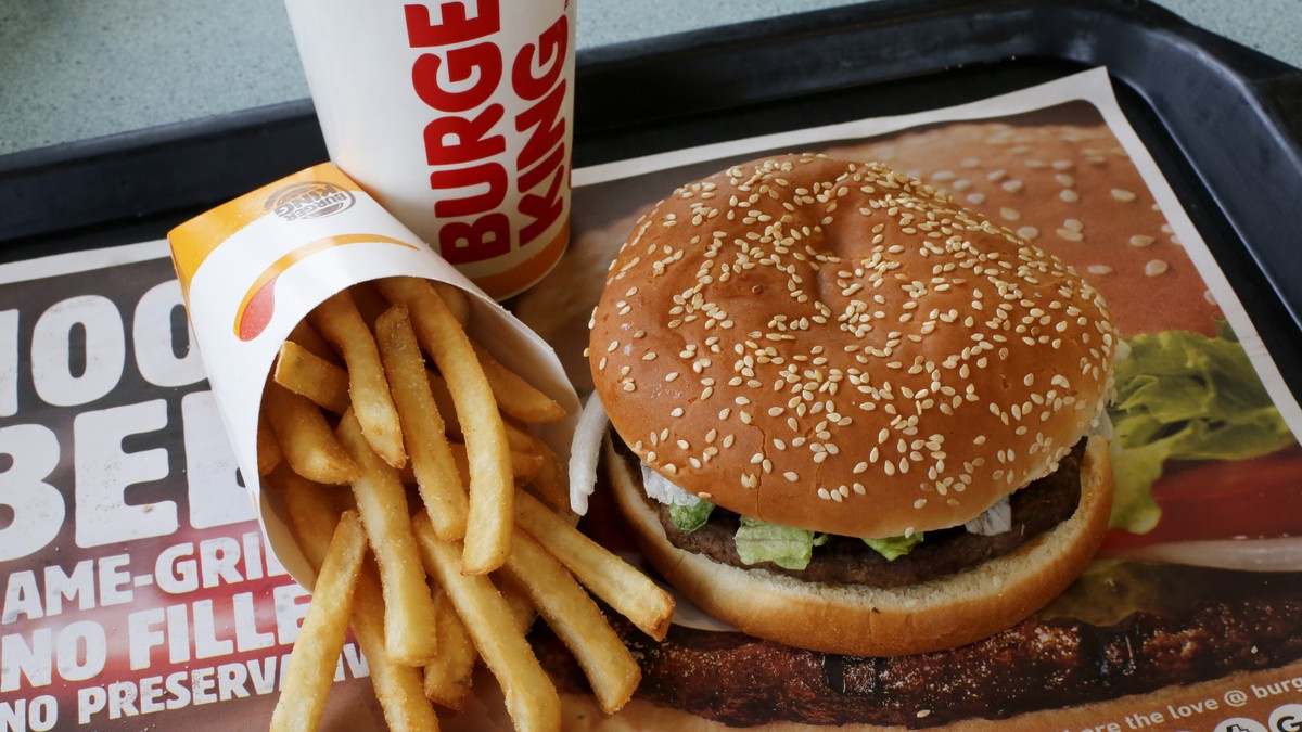 FILE- This Feb. 1, 2018, file photo shows a Burger King Whopper meal combo at a restaurant in Punxsutawney, Pa. Restaurant Brands International, the parent company of Burger King and Tim Hortons, repo ...