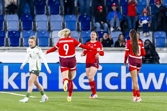 Switzerland's Svenja Foelmli, 2nd right, celebrates her goal with her teammates Switzerland's Ana-Maria Crnogorcevic #9 and Switzerland's Sydney Schertenleib, right, after scoring the 2 ...