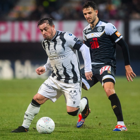 Anto Grgic (LUG), right, fight for the ball with Xherdan Shaqiri (FCB), left, during the Super League soccer match FC Lugano against FC Basel, at the Cornaredo Stadium in Lugano, Sunday, January 19, 2 ...