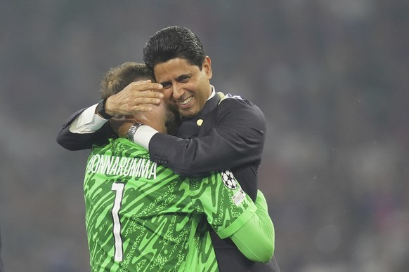 PSG&#039;s goalkeeper Gianluigi Donnarumma embraces PSG&#039;s President Nasser Al-Khelaifi after the Champions League Final soccer match between Paris Saint Germain and Inter at the Allianz Arena in  ...