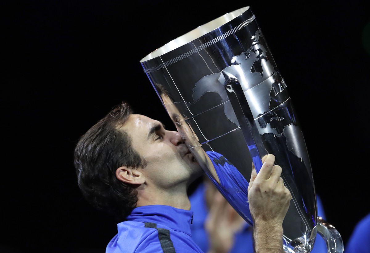 Europe's Roger Federer kisses the trophy after defeating team World in the Laver Cup tennis tournament in Prague, Czech Republic, Sunday, Sept. 24, 2017. (AP Photo/Petr David Josek)