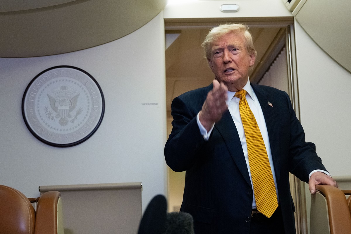 President Donald Trump speaks with reporters in flight on Air Force One after landing at U.S. Air Force Base at RAF Mildenhall, in Suffolk Eastern England, Wednesday, July 8, 2026. (AP Photo/Alex Bran ...