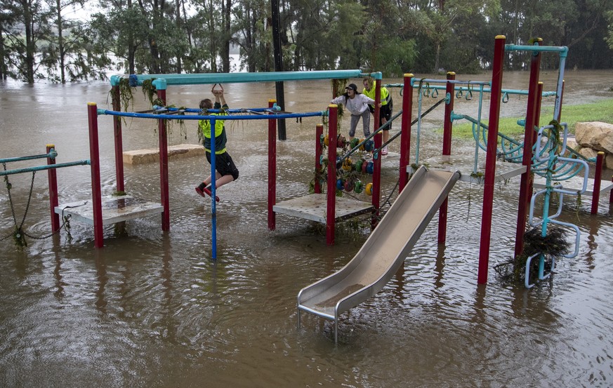 People play on equipment at a playground on the banks of the Nepean River at Jamisontown on the western outskirts of Sydney Monday, March 22, 2021. Australia&#039;s most populous state of New South Wa ...