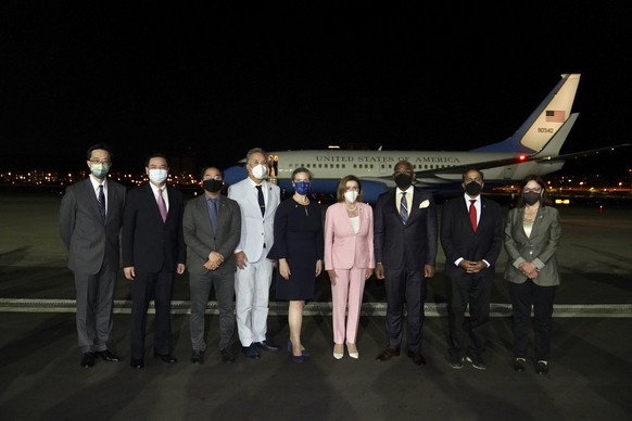 In this photo released by the Taiwan Ministry of Foreign Affairs, U.S. House Speaker Nancy Pelosi, center pose for photos after she arrives in Taipei, Taiwan, Tuesday, Aug. 2, 2022. Pelosi arrived in  ...