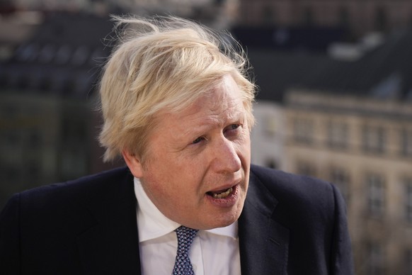 Britain&#039;s Prime Minister Boris Johnson briefs the media during the Munich Security Conference in Munich, Germany, Saturday, Feb. 19, 2022. (AP Photo/Matt Dunham, Pool)