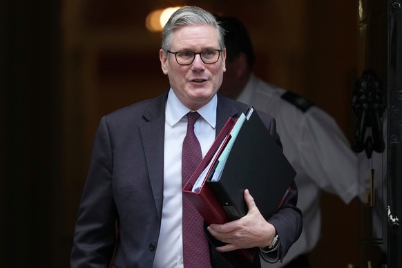 Britain's Prime Minister Keir Starmer departs 10 Downing Street to go to the House of Commons for his weekly Prime Minister's Questions in London, Wednesday, Feb. 4, 2026. (AP Photo/Alastair ...