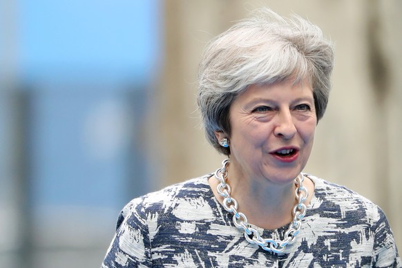 epa06882600 Britain&#039;s Prime Minister Theresa May arrives for the second day of a NATO summit in Brussels, Belgium, 12 July 2018. NATO countries&#039; heads of states and governments gather in Bru ...